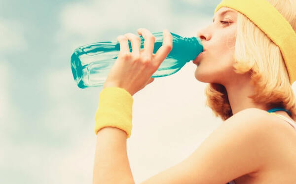 college student drinking water college student drinking water