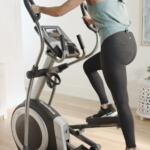 woman pedaling on front drive elliptical