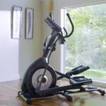side view of Schwinn 470 elliptical machine in corner of a room