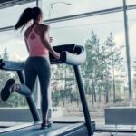 woman running on treadmill at home
