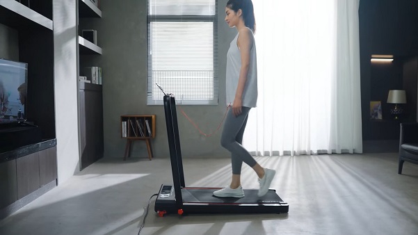 RHYTHM FUN under desk treadmill woman walking on rhythm fun under desk treadmill