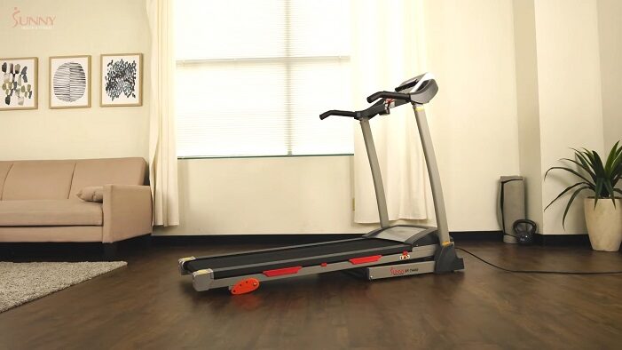 Sunny Health & Fitness SF-T4400 Treadmill with Manual Incline side view side view of the sunny health sf-t4400 treadmill in front room of house