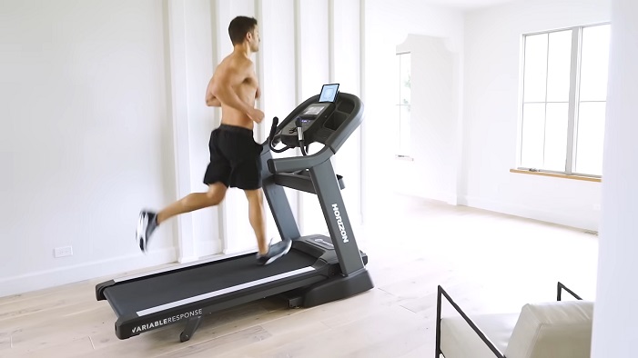 side view horizon 7.8 AT Treadmill man running on Horizon 7.8AT Treadmill side view