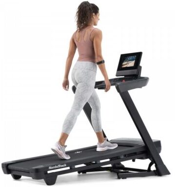Nordictrack series 10 treadmill woman walking on an incline